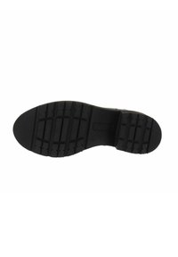 Semelle de chaussure en caoutchouc noir avec un motif de bande de roulement texturé, présentant de profonds sillons pour l'adhérence et un centre lisse pour la flexibilité.