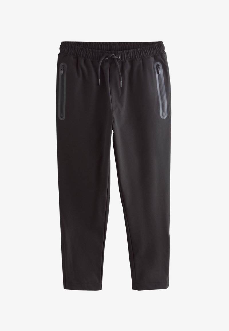 Pantalon de jogging noir fuselé avec taille élastique et cordon, comprenant deux poches latérales verticales zippées avec fermetures éclair étanches.
