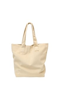 Beige stoffen draagtas met twee bovenhandvatten, voorzien van een ribbelstructuur en een ruim, open ontwerp zonder externe zakken.