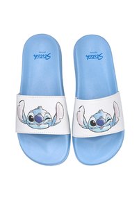 Sandalias azules con una plantilla texturizada y una tira blanca que presenta un personaje de dibujos animados con grandes ojos y orejas, sonriendo y guiñando un ojo.