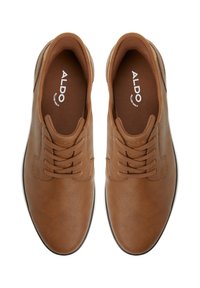 Brown textured leather sneakers with round toe, lace-up closure, and a contrasting white outsole. Logo printed on the insole.