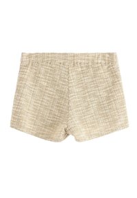 Beige vævede shorts med et struktureret mønster, elastisk talje og en længde til midten af låret. Stoffet har subtile farvevariationer.