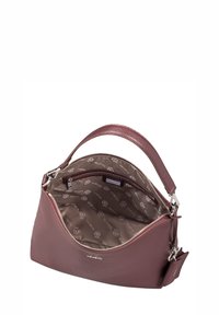Burgundy leather handbag with a curved shape, top zipper closure, and a textured exterior. Lined interior features a logo pattern.