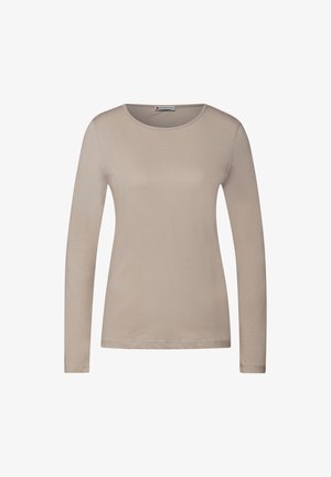 Beige långärmad skjorta i slät tyg, med rund halsringning och figurnära silhuett. Ingen synlig mönster eller detaljer.