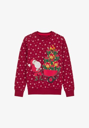 Červená mikina s grafickým motívom Mikuláša s vozíkom naloženým farebnými darčekmi, doplnená bielymi vzormi snehových vločiek.