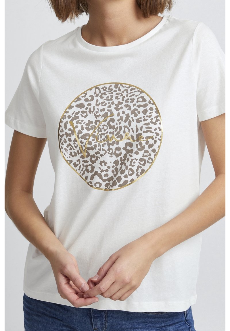 T-shirt blanc à manches courtes avec un motif léopard rond en feuille d'or et le texte "Vintage" au centre. Matière en coton.