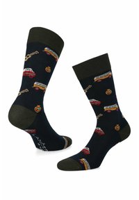 Granatowe skarpetki z zielonym mankietem, ozdobione wzorami czerwonych i żółtych samochodów oraz gitary. Materiał jest miękki o dzianinowej strukturze.