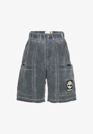 Short en velours côtelé gris avec une ceinture élastique, deux poches latérales et un patch logo Timberland sur la jambe droite. Tissu texturé.