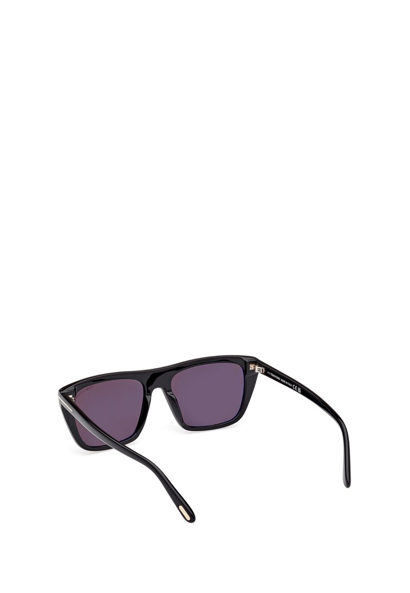 Black sunglasses with angular design, dark purple lenses, and sleek, glossy plastic frame. Features minimal gold accents on the temples.