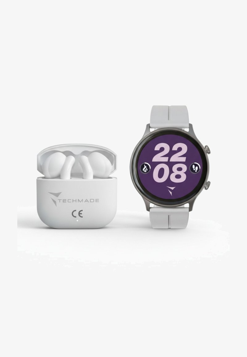Auricolari wireless in custodia bianca accanto a uno smartwatch rotondo con cornice grigia, quadrante viola e grande display digitale bianco.