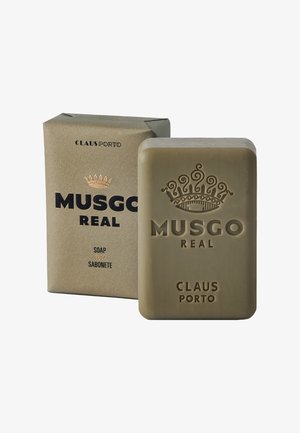 Green rectangular soap bar with embossed crown and text, accompanied by a textured cardboard box in tan color, featuring black and gold lettering.