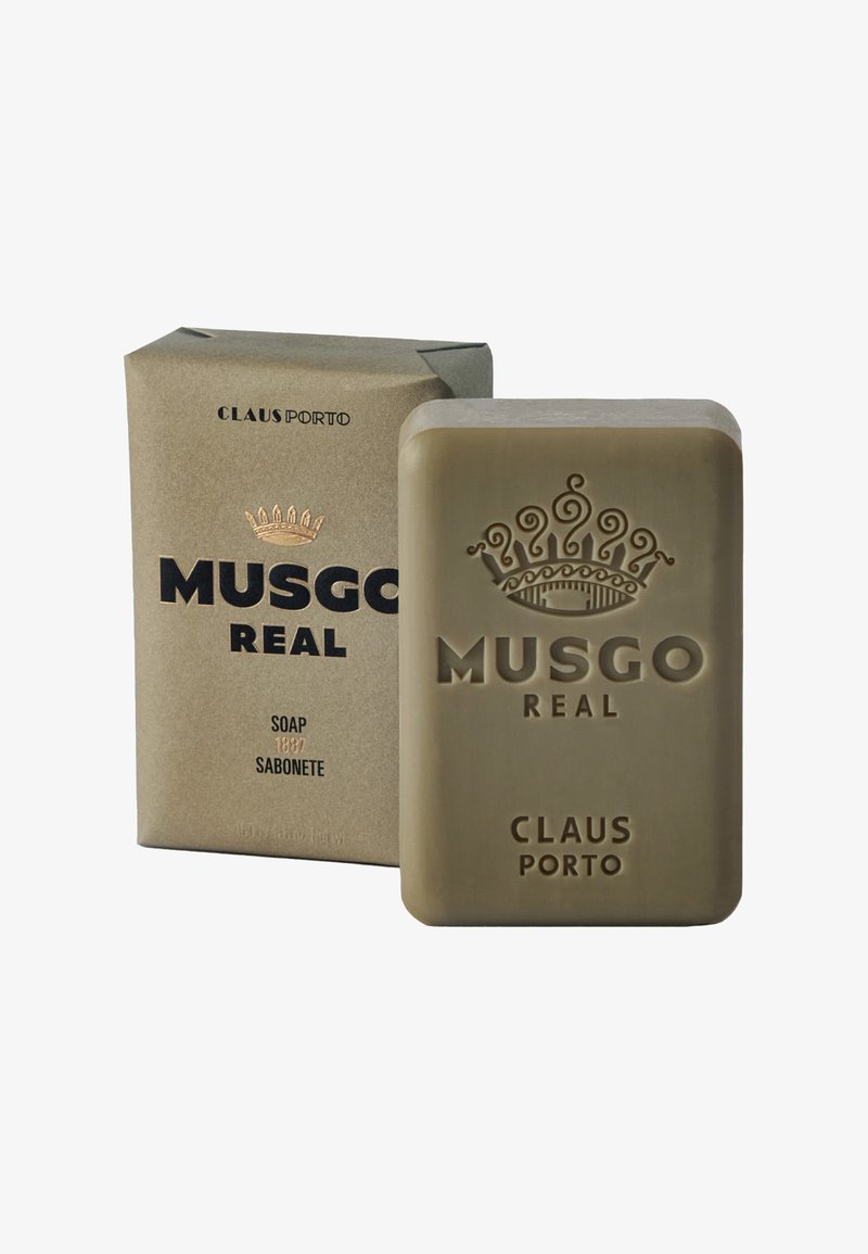 Green rectangular soap bar with embossed crown and text, accompanied by a textured cardboard box in tan color, featuring black and gold lettering.