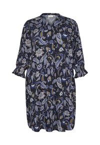 Vestido de estampado floral en azul marino, con escote en V, mangas largas con puños rizados y un corte holgado. El material parece ligero y suave.