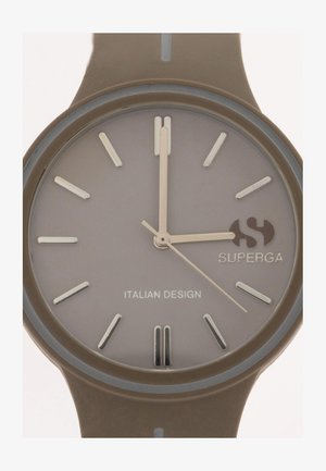 Ümar hall kell silikoonist rihmaga, hõbedased kellanäidikud ja logo. Minimalistlik disain, kus on õhukesed käed ja tekst „ITAALIA DISAIN”.}}