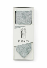 Cravate paisley grise avec mouchoir assorti dans une boîte cadeau, présentant une illustration d'un couple et le texte "VRAIS GARS."
