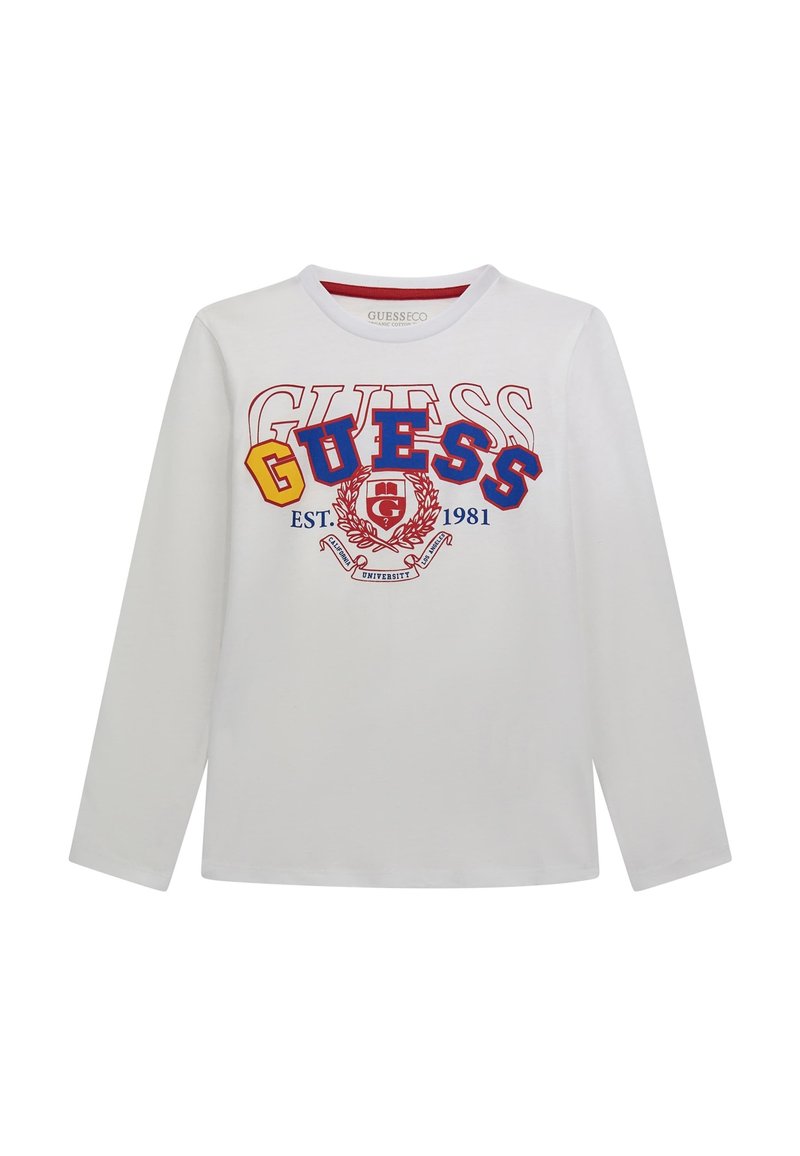 Camicia bianca a maniche lunghe con scollatura rotonda. Presenta una grafica e un emblema colorati "GUESS" con testo e elementi di design in rosso, blu e giallo.
