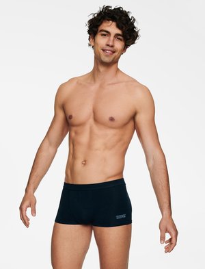 Men's black boxer shorts made from soft fabric, featuring a simple design, elastic waistband, and branding on the front left side.