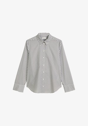 Valkoinen pitkähihaisvuorinen paita, jossa on geometrinen ruskea kuvio, napitettava kaulus ja suora helma. Valmistettu kevyestä kankaasta.