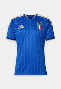 Camisa de futebol azul com padrão de folhas texturizadas, detalhes em dourado e decote em V. Apresenta o emblema da seleção nacional da Itália no lado esquerdo do peito.