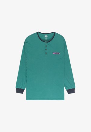 Long-sleeve teal shirt made of cotton with a henley collar, three buttons, and navy blue accents at cuffs and collar. Features a graphic logo.