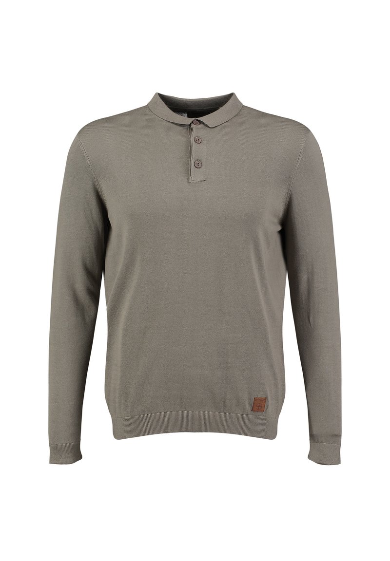 Tjallensweater in taupe met lange mouwen, voorzien van drie knopen en een klein bruin logo-embleem nabij de onderzoom, weergegeven op een effen achtergrond.