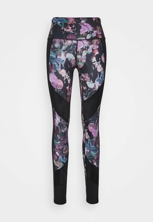 Tajta leggings i blommönster med svart midja och sidopaneler, tillverkade av elastiskt tyg med en slät yta och blank finish.