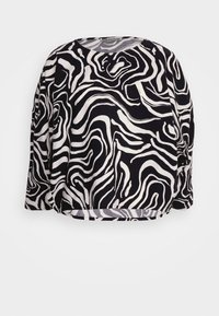 Maglietta a maniche lunghe in bianco e nero con un motivo astratto ondulato, scollatura rotonda e vestibilità comoda. Realizzata in tessuto leggero.