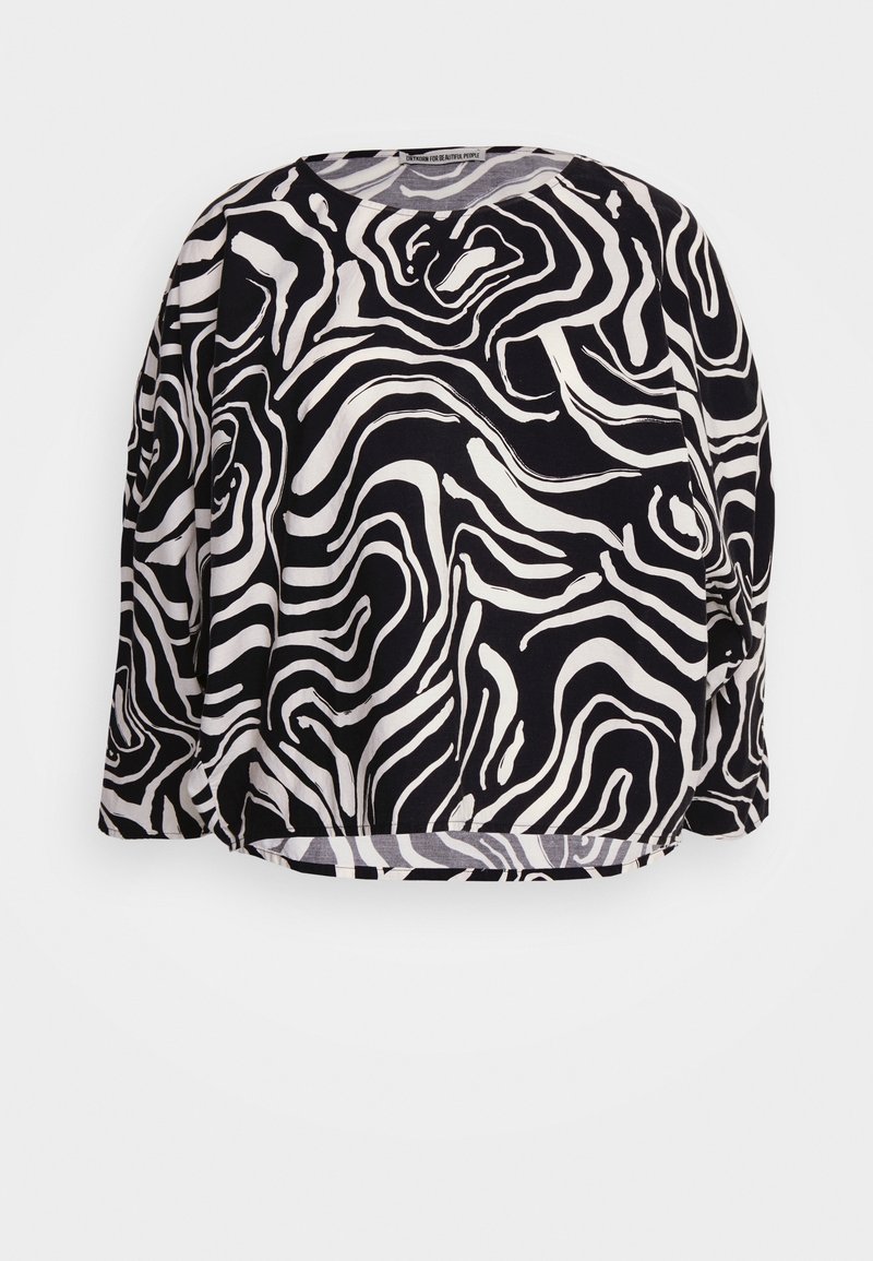 Maglietta a maniche lunghe in bianco e nero con un motivo astratto ondulato, scollatura rotonda e vestibilità comoda. Realizzata in tessuto leggero.