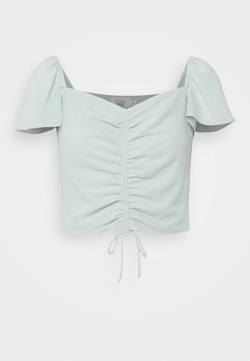 Haut court vert menthe clair avec manches courtes bouffantes et devant froncé, doté d'un cordon de serrage à l'ourlet. Texture du tissu lisse.