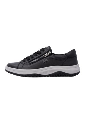Baskets noires avec lacets noirs, fermeture éclair latérale et semelle blanche épaisse avec motif noir texturé, présentées de profil sur un fond uni.