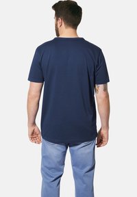 Navy blue short-sleeve T-shirt with a round neckline, crafted from soft fabric; features a plain design and a slightly extended back hem.
