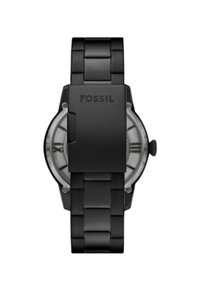 Sort metalur ur med et led-armbånd og rund urskive. Har en transparent urskive med romerske tal og 'Fossil' indgraveret på låsen.