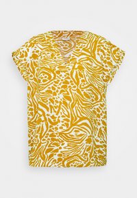 Top a maniche corte e scollo a V con un motivo animalier giallo e bianco. Realizzato in tessuto leggero, presenta una vestibilità rilassata e una texture morbida.
