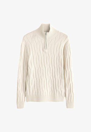 Kreem värvi nööridega kootud kampsun, millel on kõrge krae ja pool-eesmine lukku. Omab tekstuuriga mustrit, ribidega mansette ja äärt.