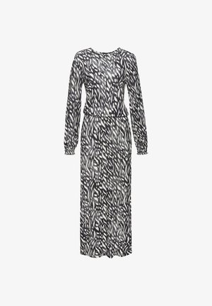 Langes schwarzes und weißes Kleid mit einem fließenden Muster, langen Ärmeln, rundem Ausschnitt und elastischem Bund; aus leichtem Stoff gefertigt.