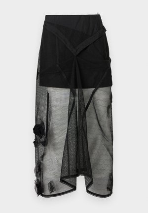 Jupe en mesh noir à design superposé, avec une ceinture unie et des accents floraux. Surface texturée et ourlet tombant sous le genou.
