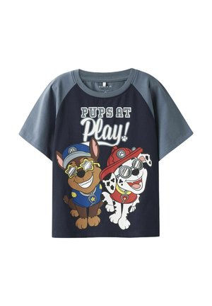 Navy blue short-sleeve t-shirt with gray sleeves featuring cartoon dogs in sunglasses and text "PUPS AT Play!" in bold white and light colors.
