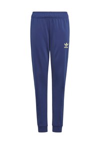 Tums zila sporta bikses, izgatavotas no mīkstas auduma, ar elastīgu jostu, aprocēm un kontrastējošu dzeltenu Adidas logo.
