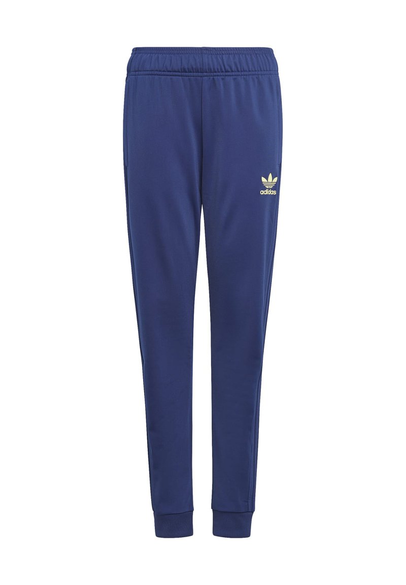 Tums zila sporta bikses, izgatavotas no mīkstas auduma, ar elastīgu jostu, aprocēm un kontrastējošu dzeltenu Adidas logo.