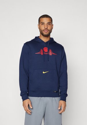 Sötétkék kapucnis pulóver, puha anyagból készült, elöl piros kosárlabda és híd grafika található, valamint egy sárga Nike logó.
