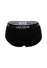 Zwarte katoenen onderbroek met een brede elastische tailleband met het "LACOSTE" logo in het wit. Klassiek slipontwerp, met een gladde textuur en zonder patronen.