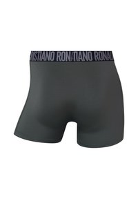 Mørkegrå bokser-shorts lavet af glat stof med et sort elastisk taljebånd med teksten "Cristiano Ronaldo" i kontrasterende bogstaver.