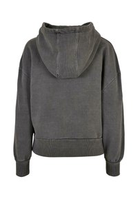Szara bluza z kapturem o kroju cropped, z prążkowanymi mankietami i dolnym wykończeniem. Materiał wydaje się miękki, z lekko teksturowanym wykończeniem.