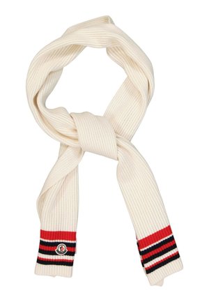 Kremfarvet strikket halstørklæde med røde, sorte og hvide stribede ender og et lille rundt logopatch på den ene side.