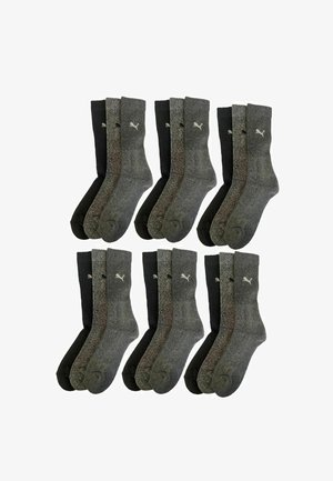 Set von acht Socken in Grautönen und Schwarz. Gerippter Bund, mittlere Dicke, mit Logo auf der Oberseite. Weicher Stoff und elastische Passform.