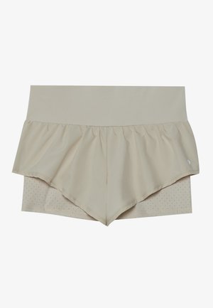Calções atléticos bege com um design de babados em flare, apresentando uma camada inferior texturizada com perfurações. Cintura elástica para conforto.