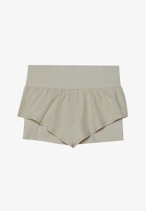 Calções atléticos bege com um design de babados em flare, apresentando uma camada inferior texturizada com perfurações. Cintura elástica para conforto.
