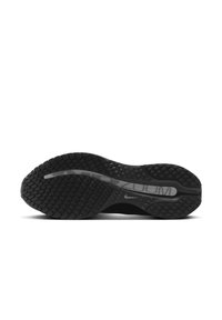 Semelle noire de chaussure de course Nike Zoom avec motif de grip texturé et logo Nike swoosh central.