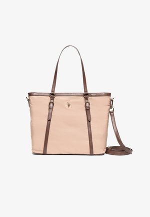 Beige Tragetasche mit braunen Kunstledergriffen und Akzenten. Verfügt über ein goldenes Logo vorne und einen abnehmbaren Schultergurt. Glatte Textur.