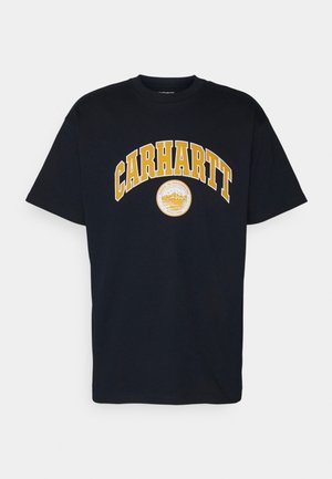 T-shirt Carhartt noir avec grand logo jaune en arc et emblème circulaire centré sur la poitrine.